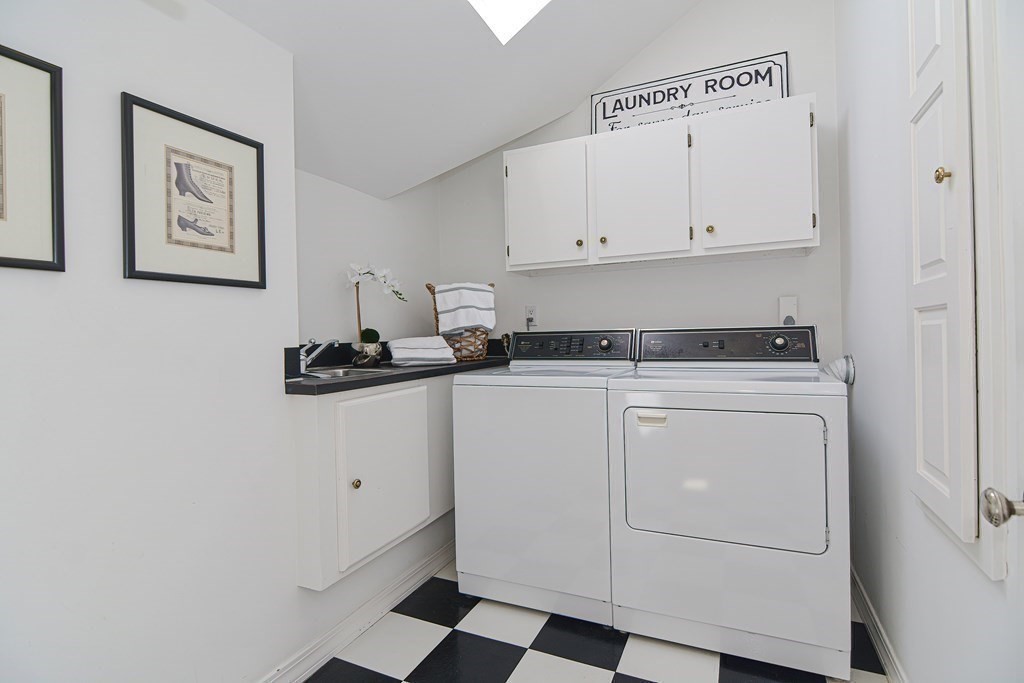 202 Paine Street Bellingham, MA 02019 - Photo 21 of 42 a room with storage and utility