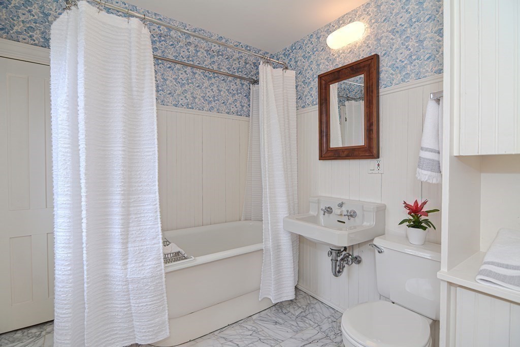 202 Paine Street Bellingham, MA 02019 - Photo 22 of 42 a bathroom with a sink toilet and shower