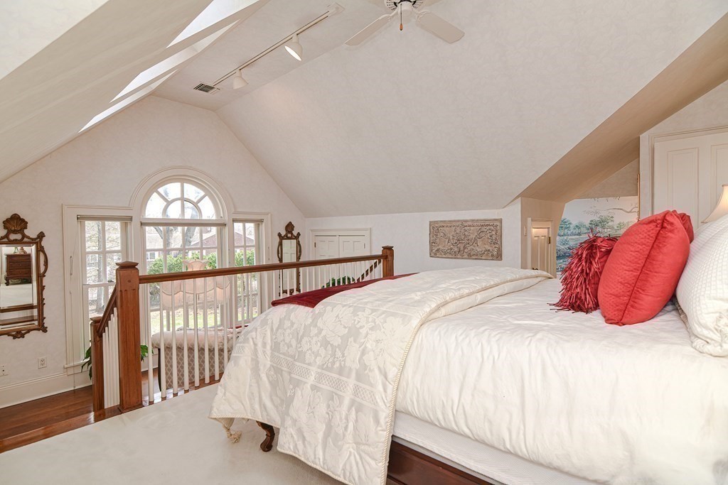 202 Paine Street Bellingham, MA 02019 - Photo 24 of 42 a bedroom with a large bed and a large window