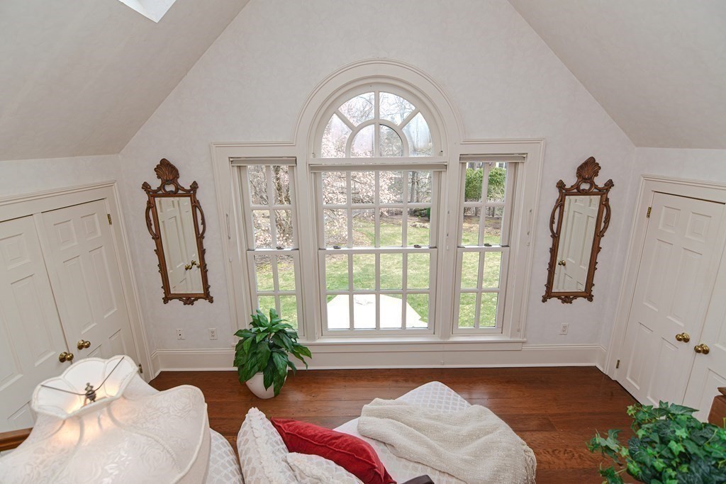 202 Paine Street Bellingham, MA 02019 - Photo 25 of 42 a living room with furniture and a large window