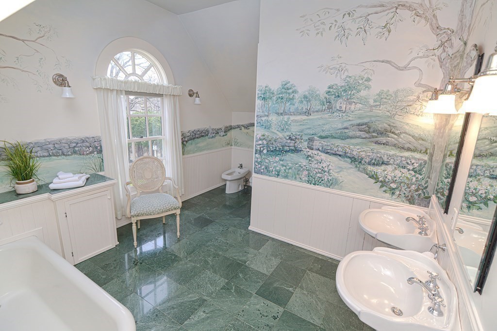 202 Paine Street Bellingham, MA 02019 - Photo 27 of 42 a white toilet sitting next to a bathroom sink and tub