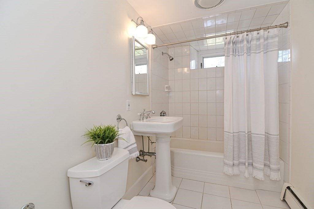 202 Paine Street Bellingham, MA 02019 - Photo 34 of 42 a bathroom with a sink toilet and shower