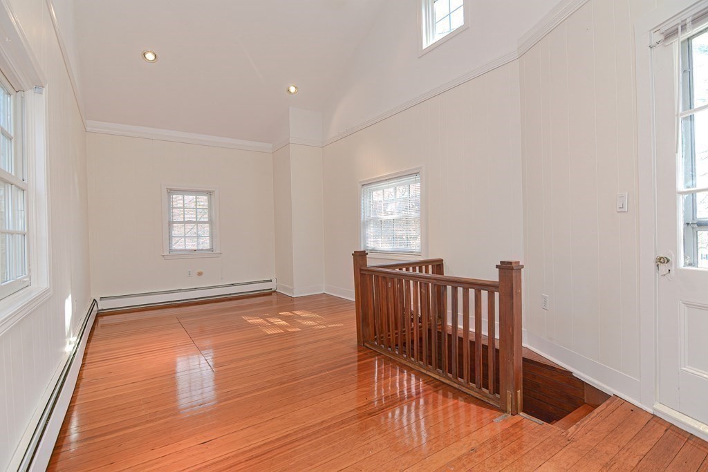 202 Paine Street Bellingham, MA 02019 - Photo 35 of 42 a view of a room with wooden floor and window