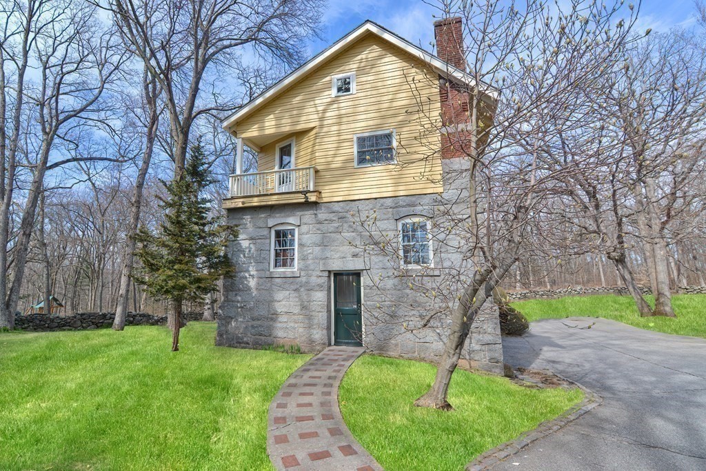 202 Paine Street Bellingham, MA 02019 - Photo 36 of 42 a front view of a house with a yard