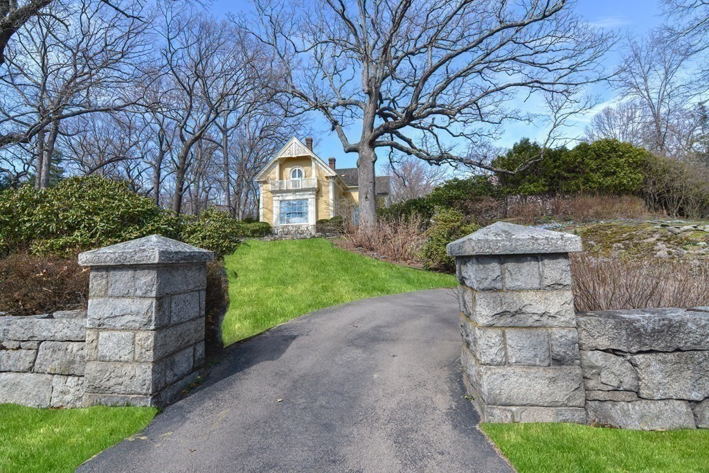 202 Paine Street Bellingham, MA 02019 - Photo 38 of 42 a front view of a house with a yard and garage