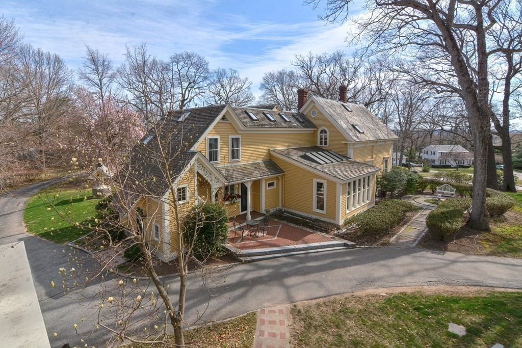 202 Paine Street Bellingham, MA 02019 - Photo 41 of 42 a front view of a house with a garden