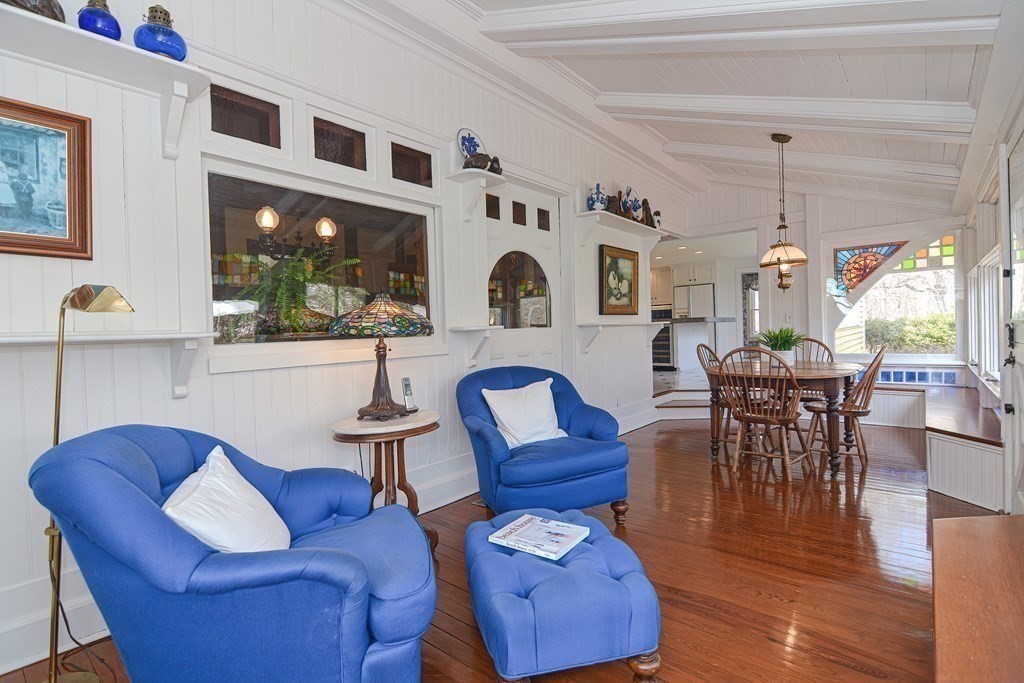 202 Paine Street Bellingham, MA 02019 - Photo 10 of 42 a living room with furniture a chandelier and a large window