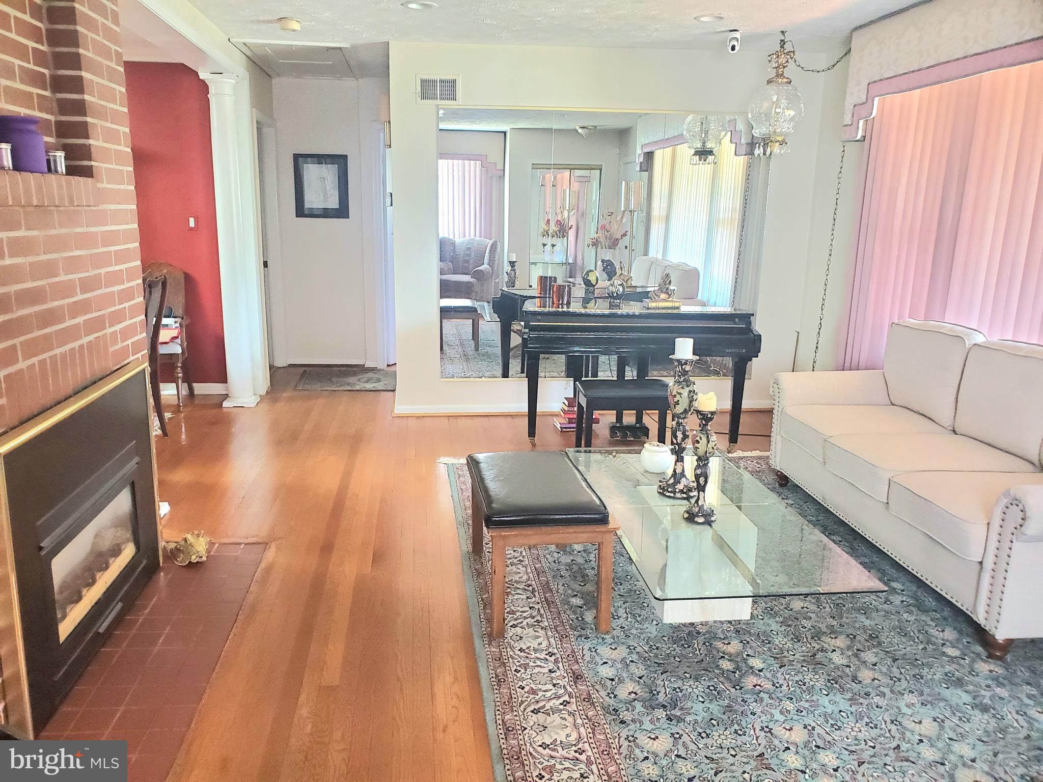 1514 Oakview Drive Silver Spring, MD 20903 - Photo 2 of 9 a living room with furniture and a fireplace