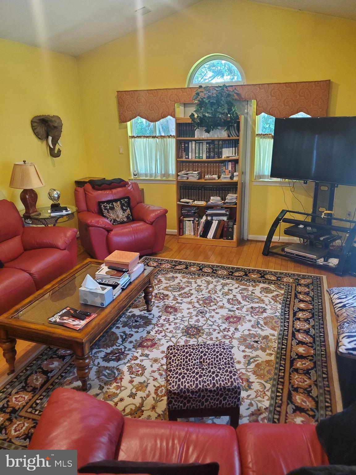 1514 Oakview Drive Silver Spring, MD 20903 - Photo 8 of 9 a living room with furniture a rug and a flat screen tv