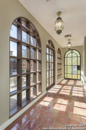 a view of an empty room with windows