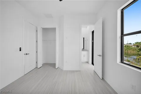 a view of hallway with wooden floor
