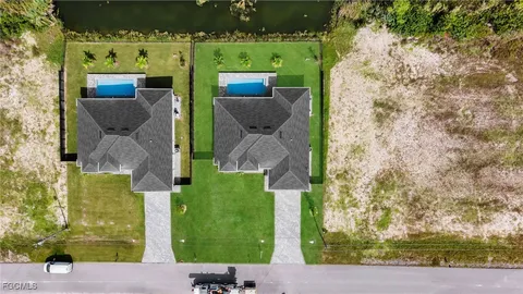 an aerial view of a house with a lake view