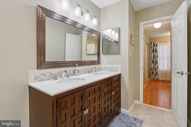 a view of a yard with wooden fence and trees