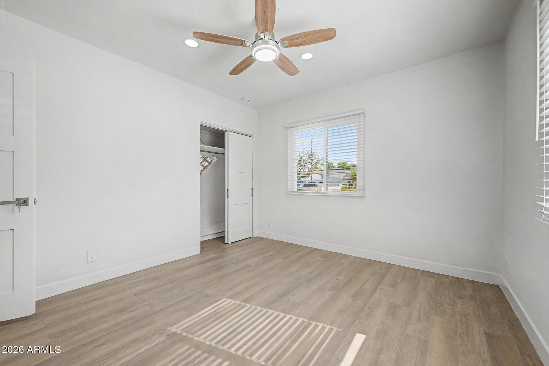 532 East Cheery Lynn Road Phoenix, AZ 85014 - Photo 24 of 37 wooden floor in an empty room with a window