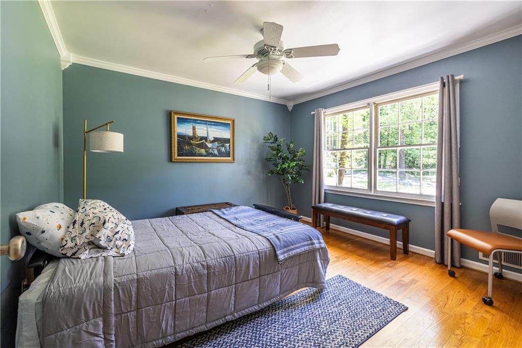 3598 Hidden Acres Drive Atlanta, GA 30340 - Photo 13 of 23 a bedroom with a bed and a chandelier