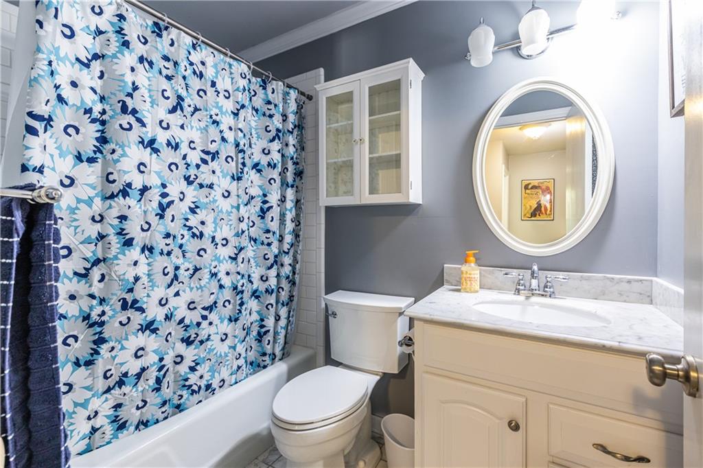 3598 Hidden Acres Drive Atlanta, GA 30340 - Photo 16 of 23 a bathroom with a sink toilet and mirror