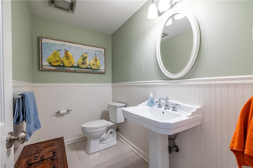 3598 Hidden Acres Drive Atlanta, GA 30340 - Photo 17 of 23 a bathroom with a toilet a sink and a mirror