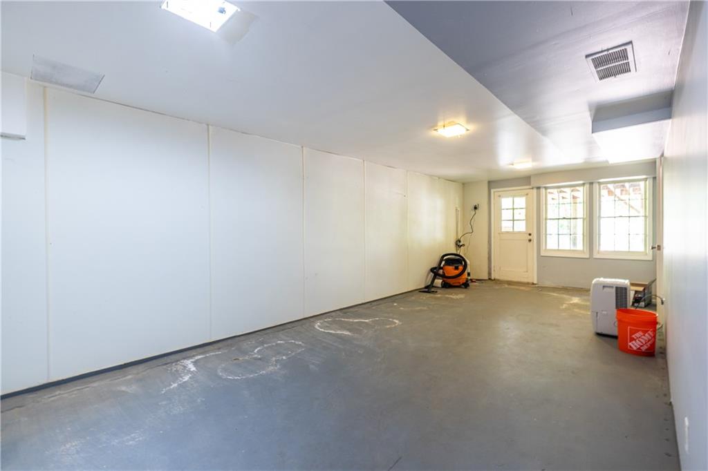 3598 Hidden Acres Drive Atlanta, GA 30340 - Photo 18 of 23 a view of a room with gym equipment and windows