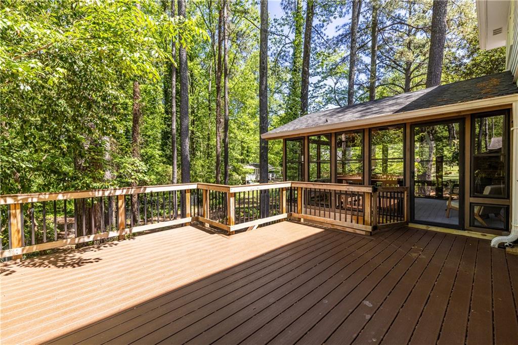 3598 Hidden Acres Drive Atlanta, GA 30340 - Photo 20 of 23 a view of a balcony with chairs and wooden floor