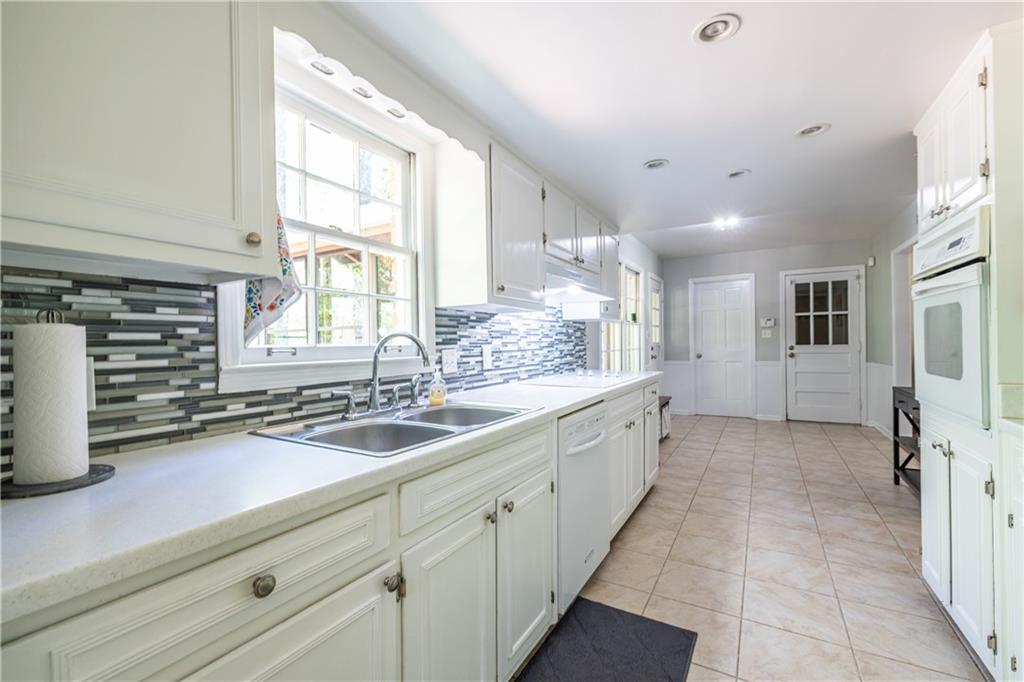 3598 Hidden Acres Drive Atlanta, GA 30340 - Photo 4 of 23 a large white kitchen with a large window