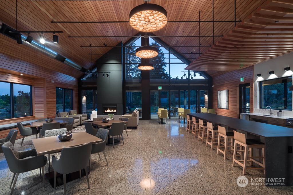 2720 Arrowroot Street Southeast Lacey, WA 98513 - Photo 16 of 18 a group of people sitting in a room
