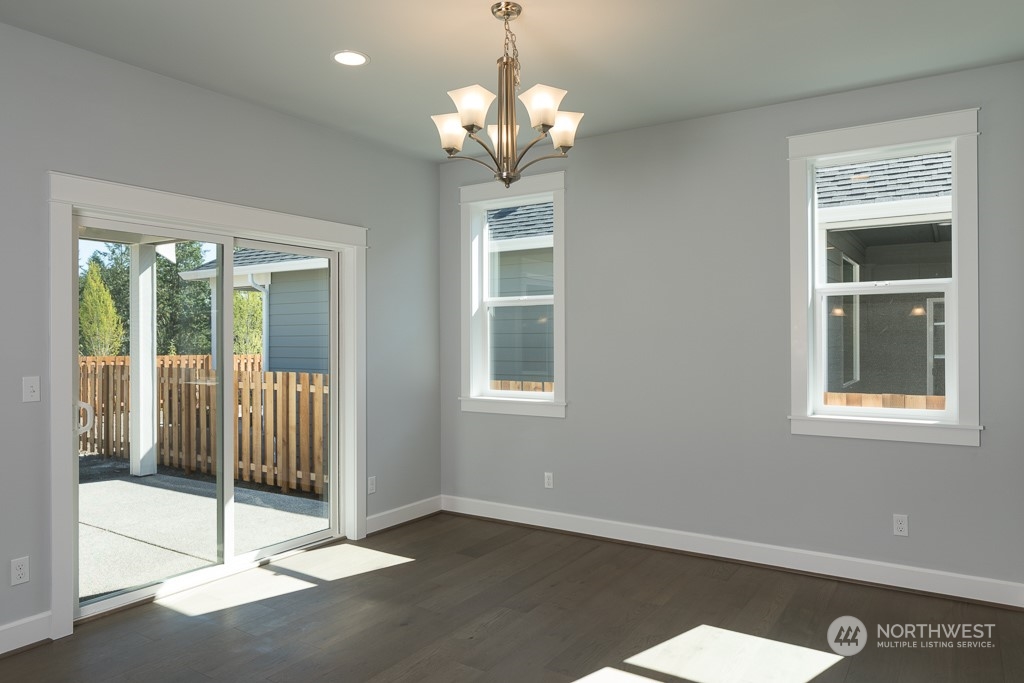 2720 Arrowroot Street Southeast Lacey, WA 98513 - Photo 5 of 18 a view of a livingroom with a chandelier