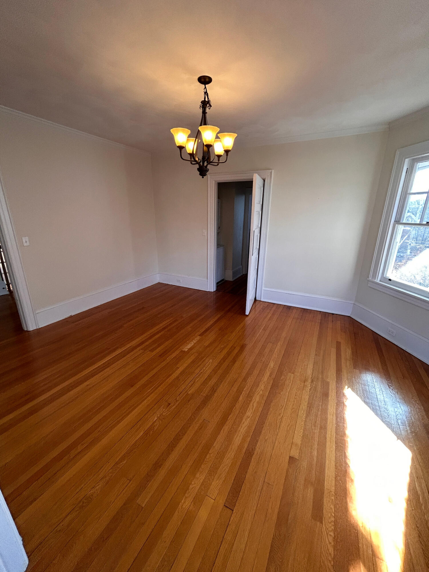 360 Walnut Avenue Southwest, Unit B Roanoke, VA 24016 - Photo 18 of 60 a view of room with wooden floor and chandelier