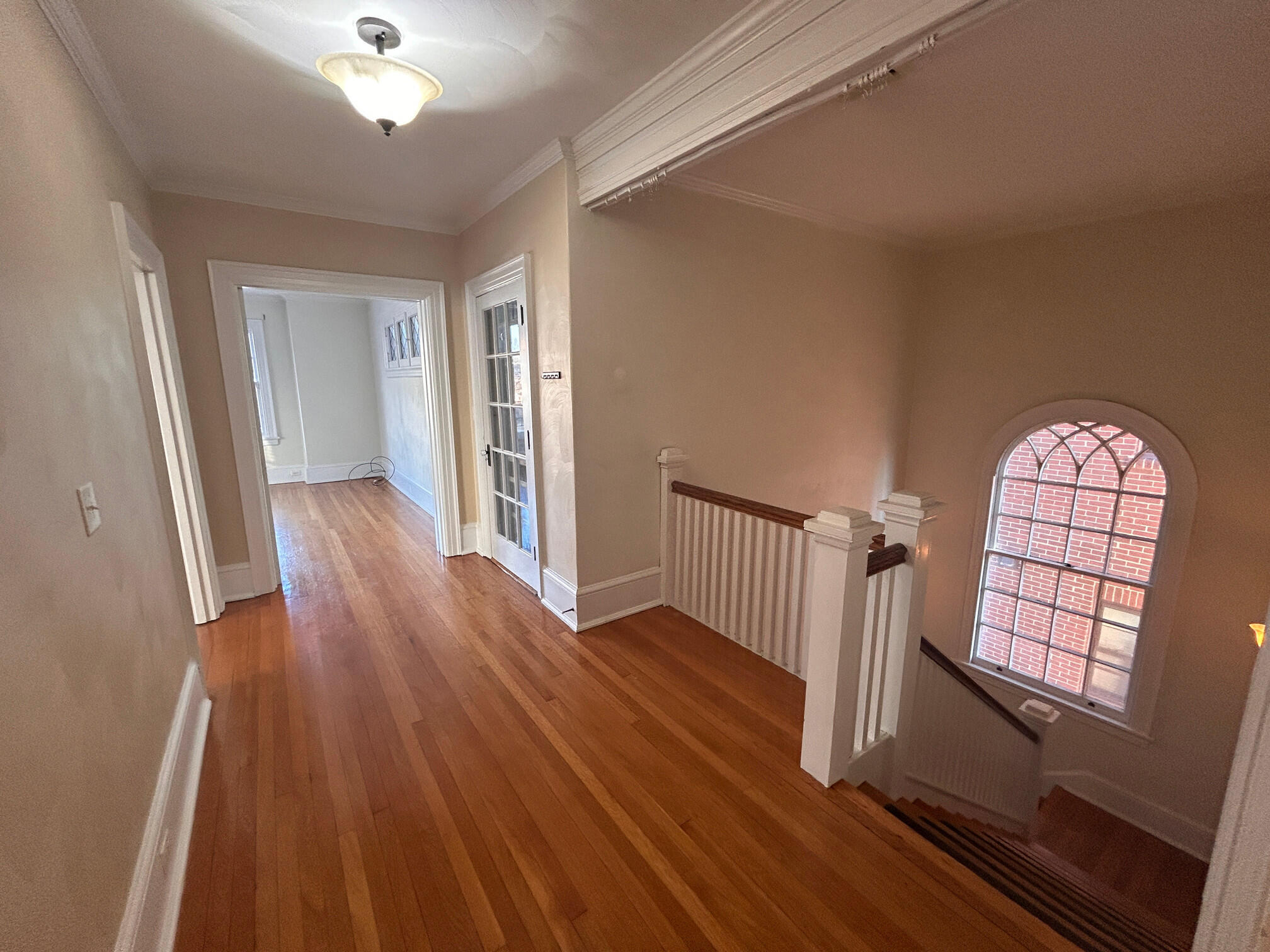 360 Walnut Avenue Southwest, Unit B Roanoke, VA 24016 - Photo 6 of 60 wooden floor in an empty room with a window
