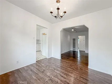a view of a livingroom with wooden floor