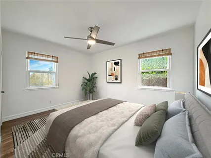 a bedroom with a large bed and a window