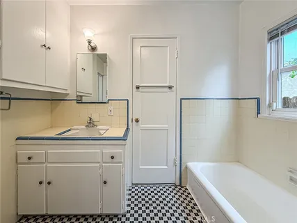 a bathroom with a sink and a bathtub