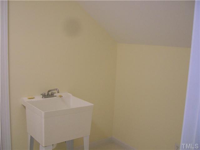 3520 Barron Berkeley Way Raleigh, NC 27612 - Photo 15 of 16 a white sink sitting next to a white wall