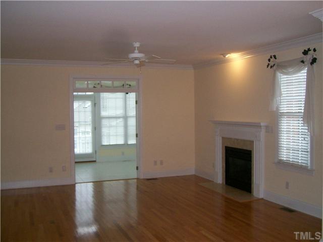 3520 Barron Berkeley Way Raleigh, NC 27612 - Photo 2 of 16 an empty room with wooden floor and windows