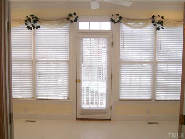 3520 Barron Berkeley Way Raleigh, NC 27612 - Photo 4 of 16 a bathroom with a window and a bathtub