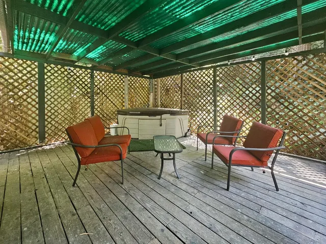 a view of a chairs and table in the patio
