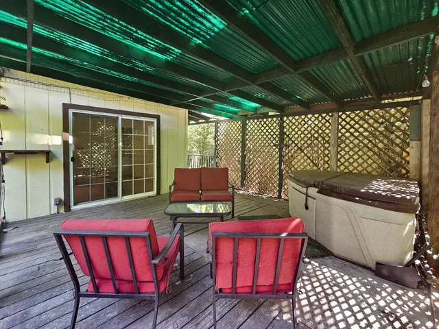 a view of a deck with wooden floor and outdoor space
