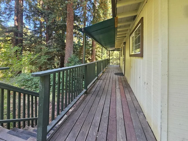 a view of balcony with wooden floor