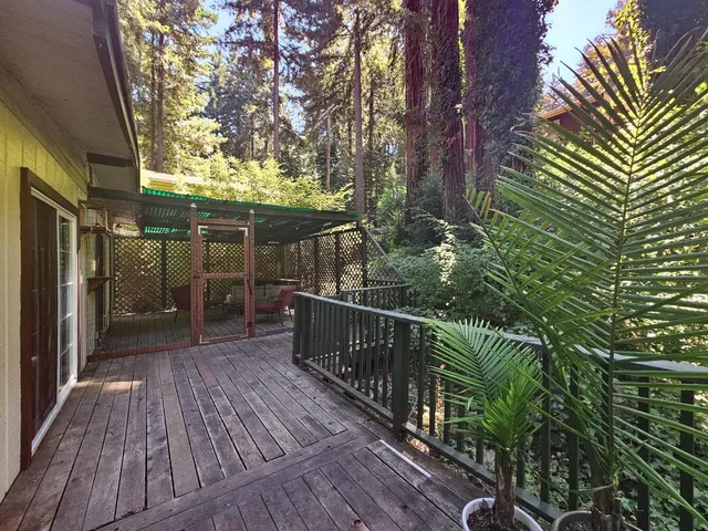 a view of balcony with wooden floor