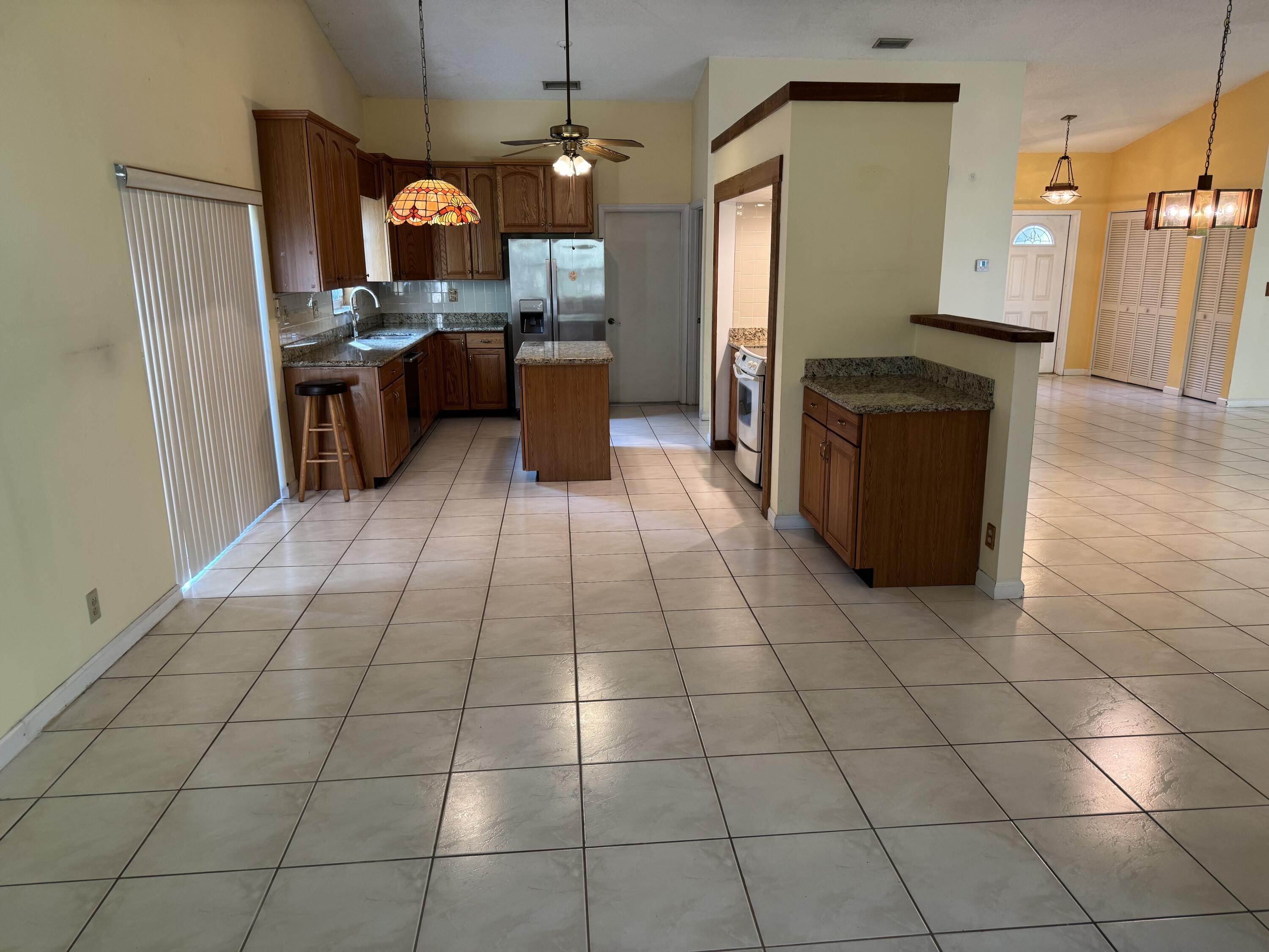 21068 Shady Vista Lane Boca Raton, FL 33428 - Photo 13 of 42 FAMILY ROOM VIEW TO EAT-IN KITCHEN