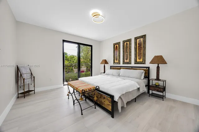 a spacious bedroom with a bed and a table