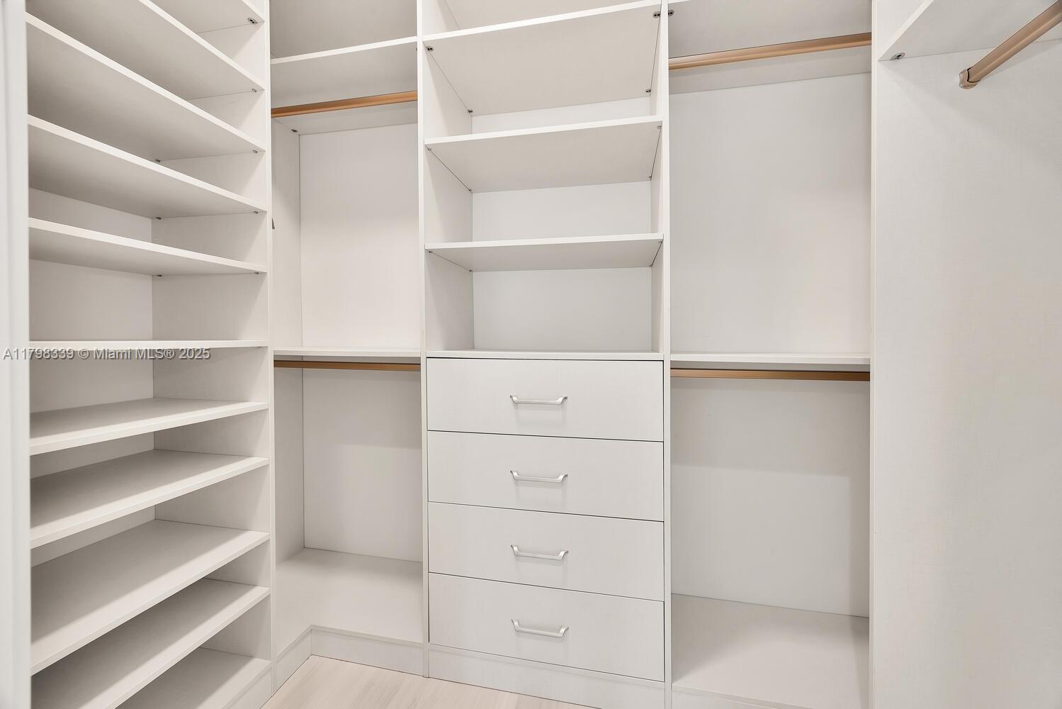 3224 Elizabeth Street Miami, FL 33133 - Photo 15 of 30 a view of walk in closet with empty racks