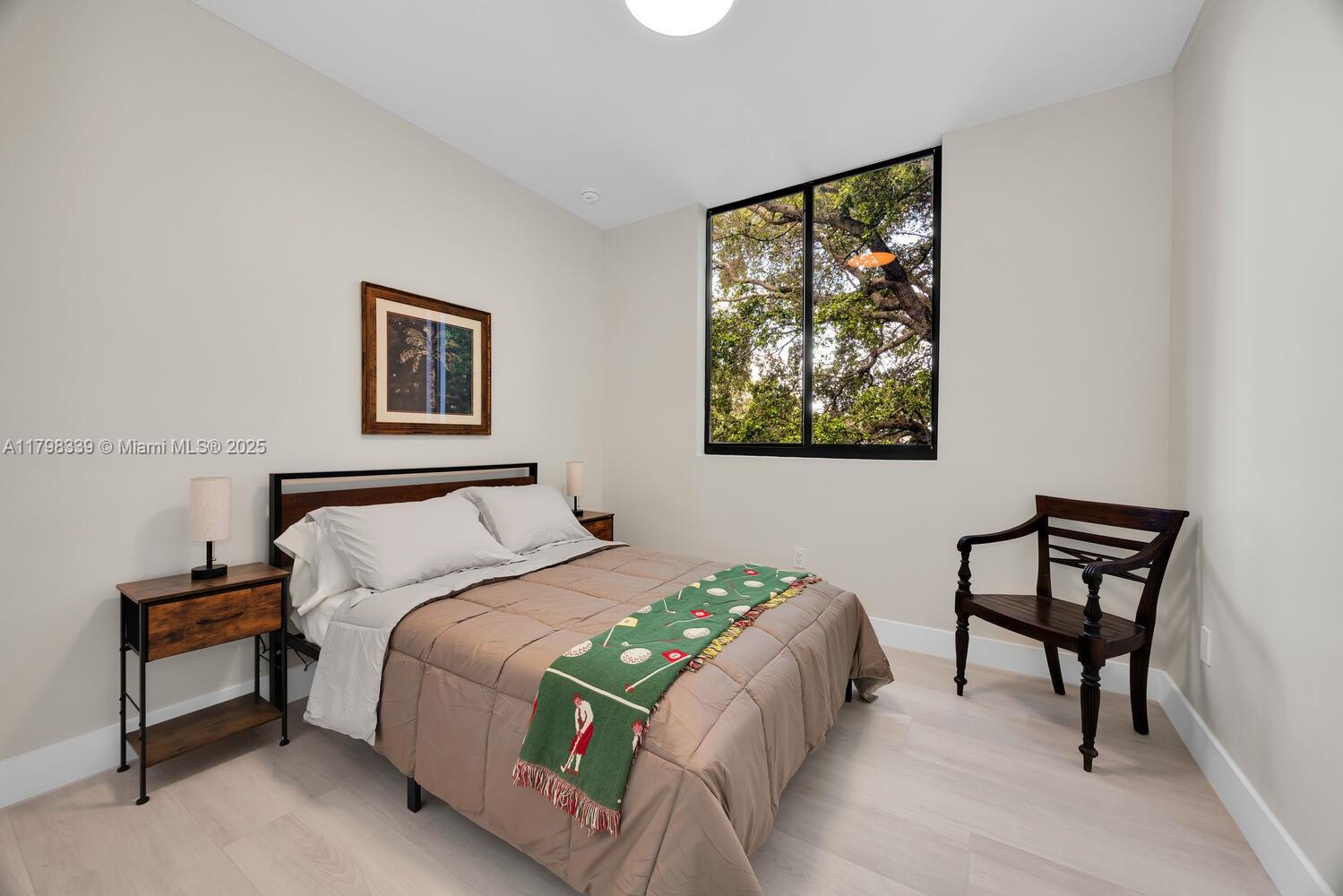 3224 Elizabeth Street Miami, FL 33133 - Photo 18 of 30 a bedroom with a bed and a window