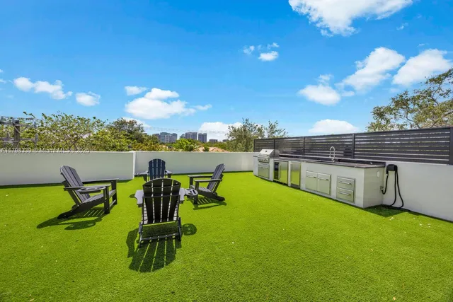 a view of a swimming pool with lawn chairs