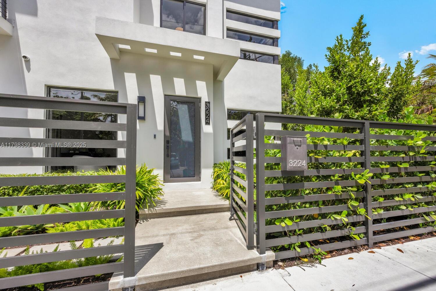 3224 Elizabeth Street Miami, FL 33133 - Photo 3 of 30 a front view of a building with garden