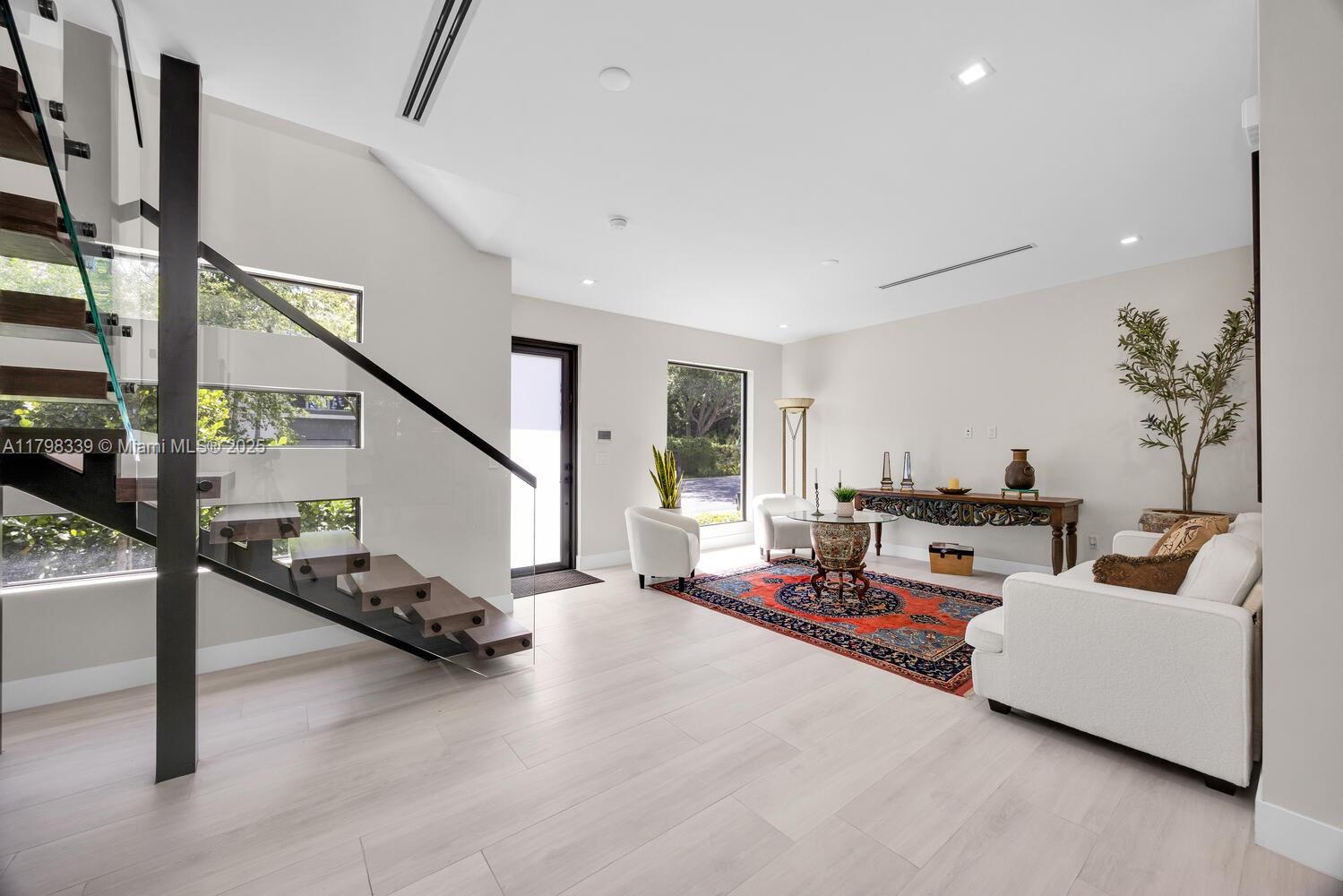 3224 Elizabeth Street Miami, FL 33133 - Photo 6 of 30 a living room with furniture and a potted plant