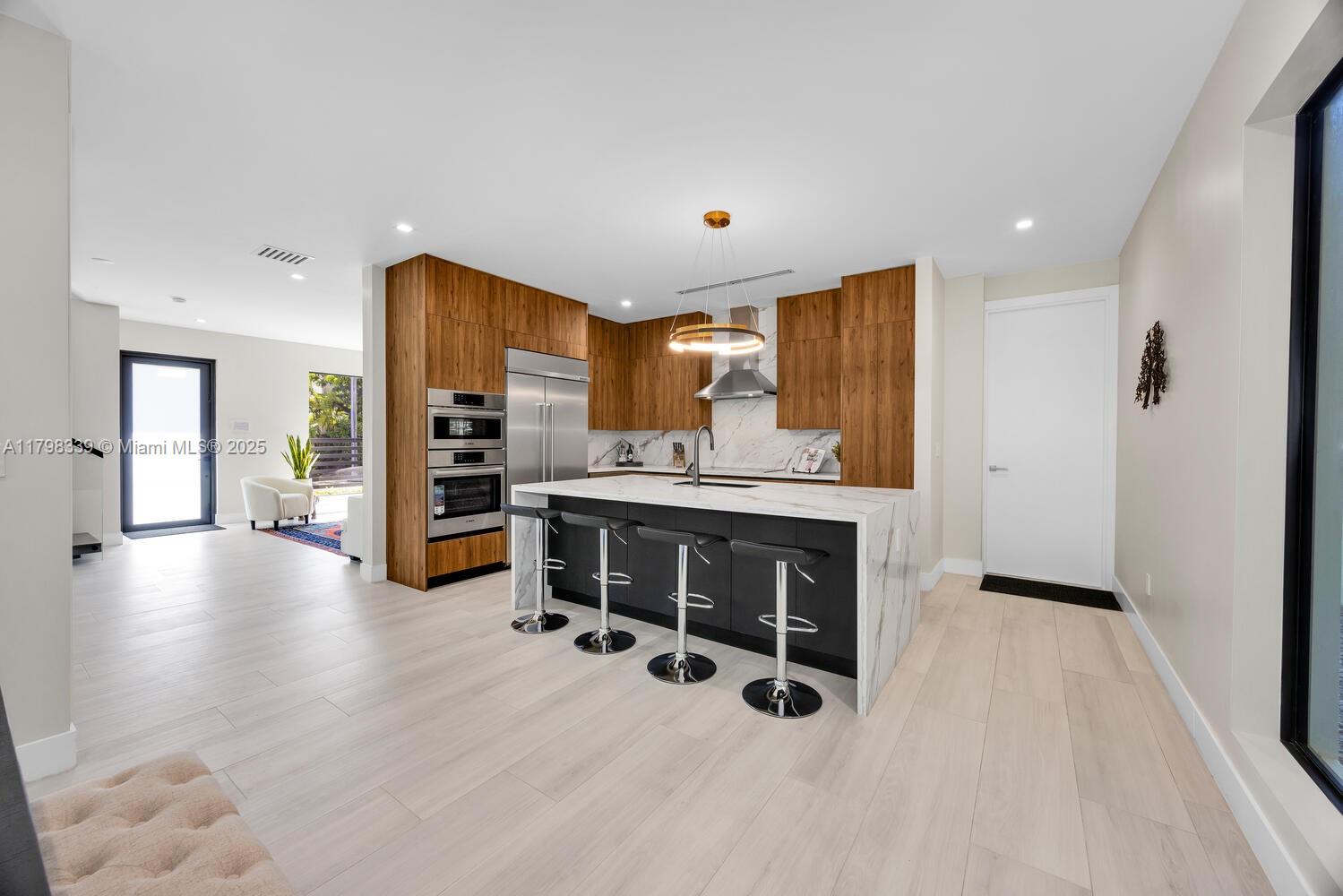 3224 Elizabeth Street Miami, FL 33133 - Photo 8 of 30 a view of kitchen with furniture and a refrigerator