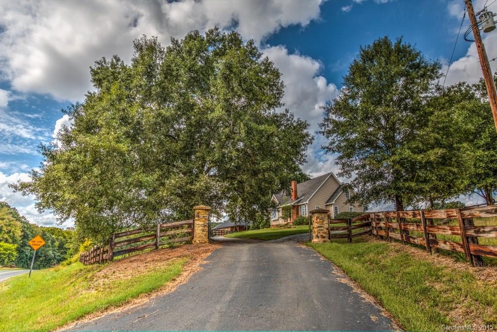4031 Tite Road Stanfield, NC 28163 - Photo 1 of 24 a view of a town with large trees