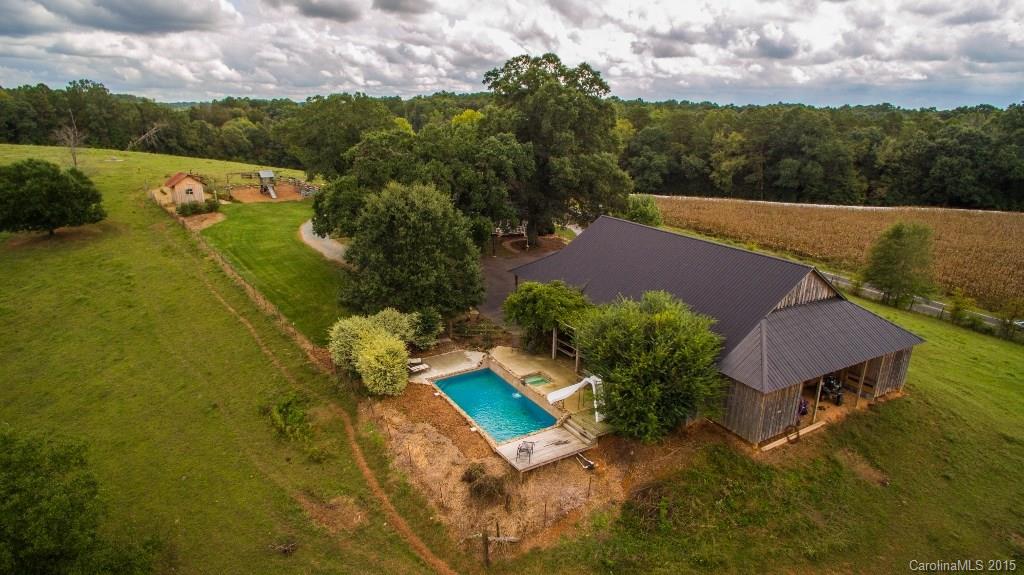 4031 Tite Road Stanfield, NC 28163 - Photo 2 of 24 an aerial view of a house with a yard