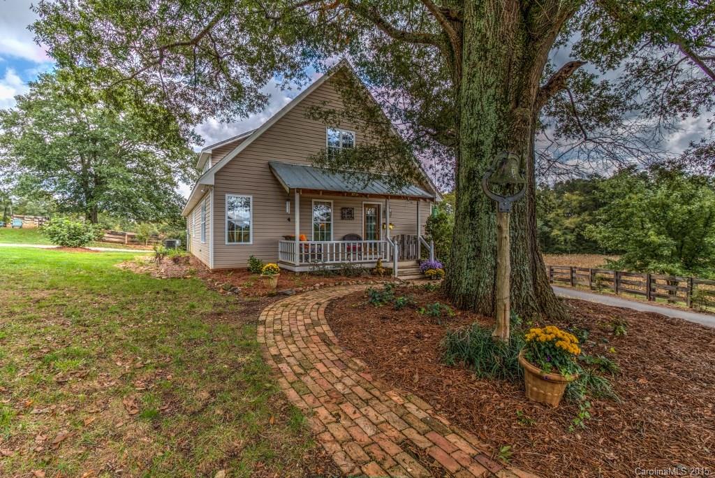 4031 Tite Road Stanfield, NC 28163 - Photo 18 of 24 a front view of a house with garden