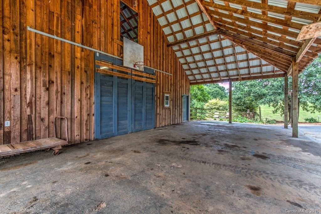 4031 Tite Road Stanfield, NC 28163 - Photo 20 of 24 a view of a house with a backyard